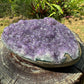 Palm-scale view of one Amethyst raw geode for scale, from Artigas, Uruguay.