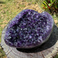 Close-up of purple Amethyst raw geode, carried for Stress Relief and Sleep, showing natural color depth.