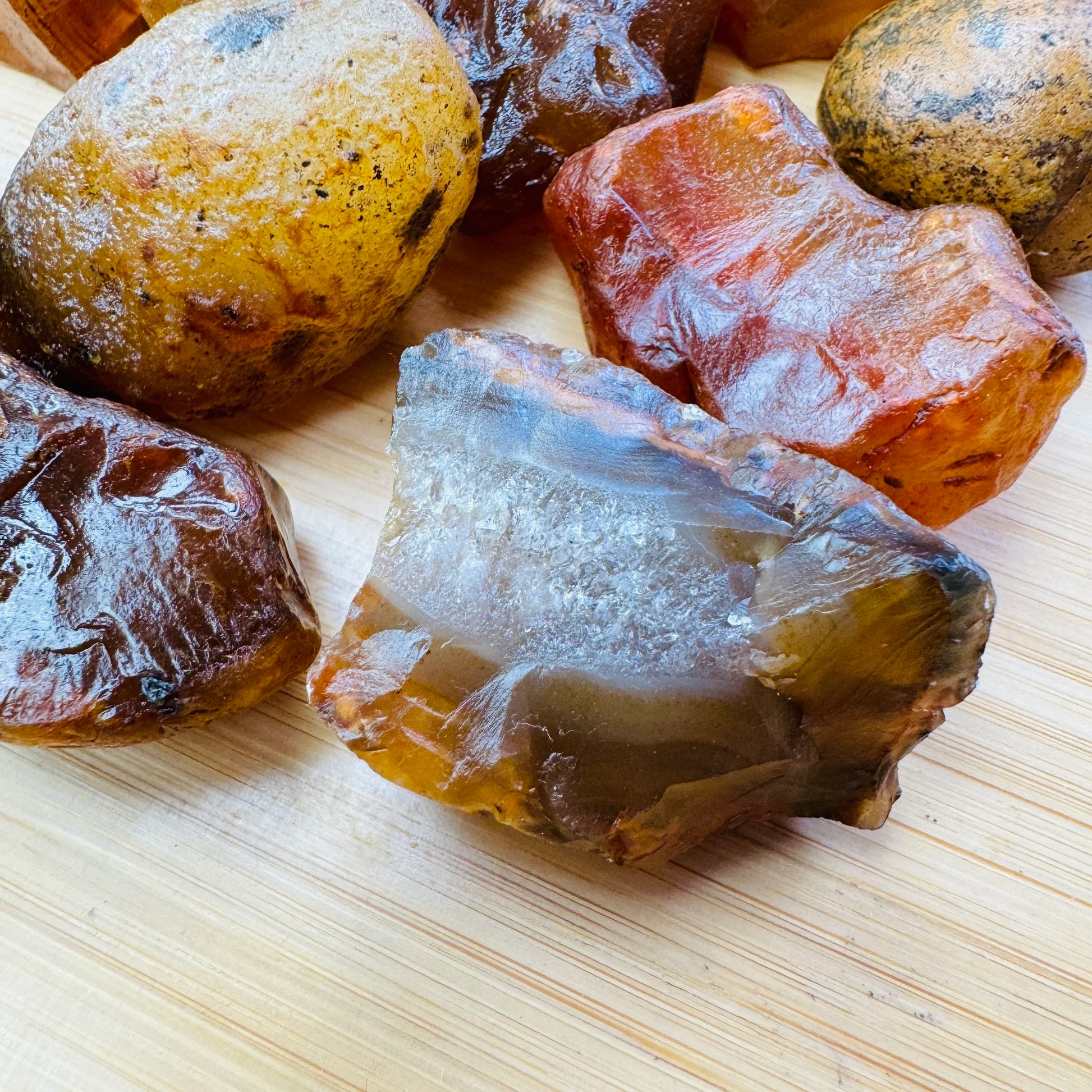 Close-up detail of Grade A Carnelian raw showing natural orange, red tones and texture