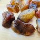 Side profile of Grade A Carnelian raw with natural form and inclusions