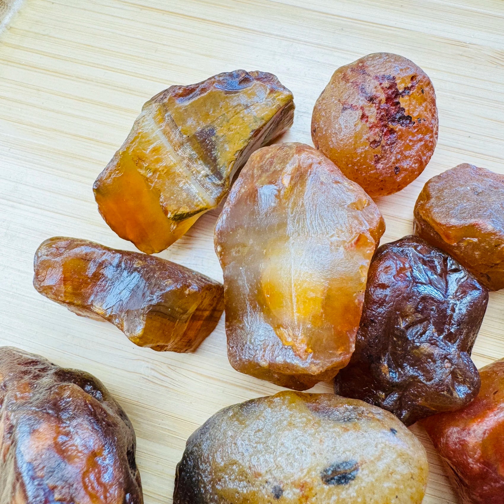 Underside view of Grade A Carnelian raw stone, showing tight grain.