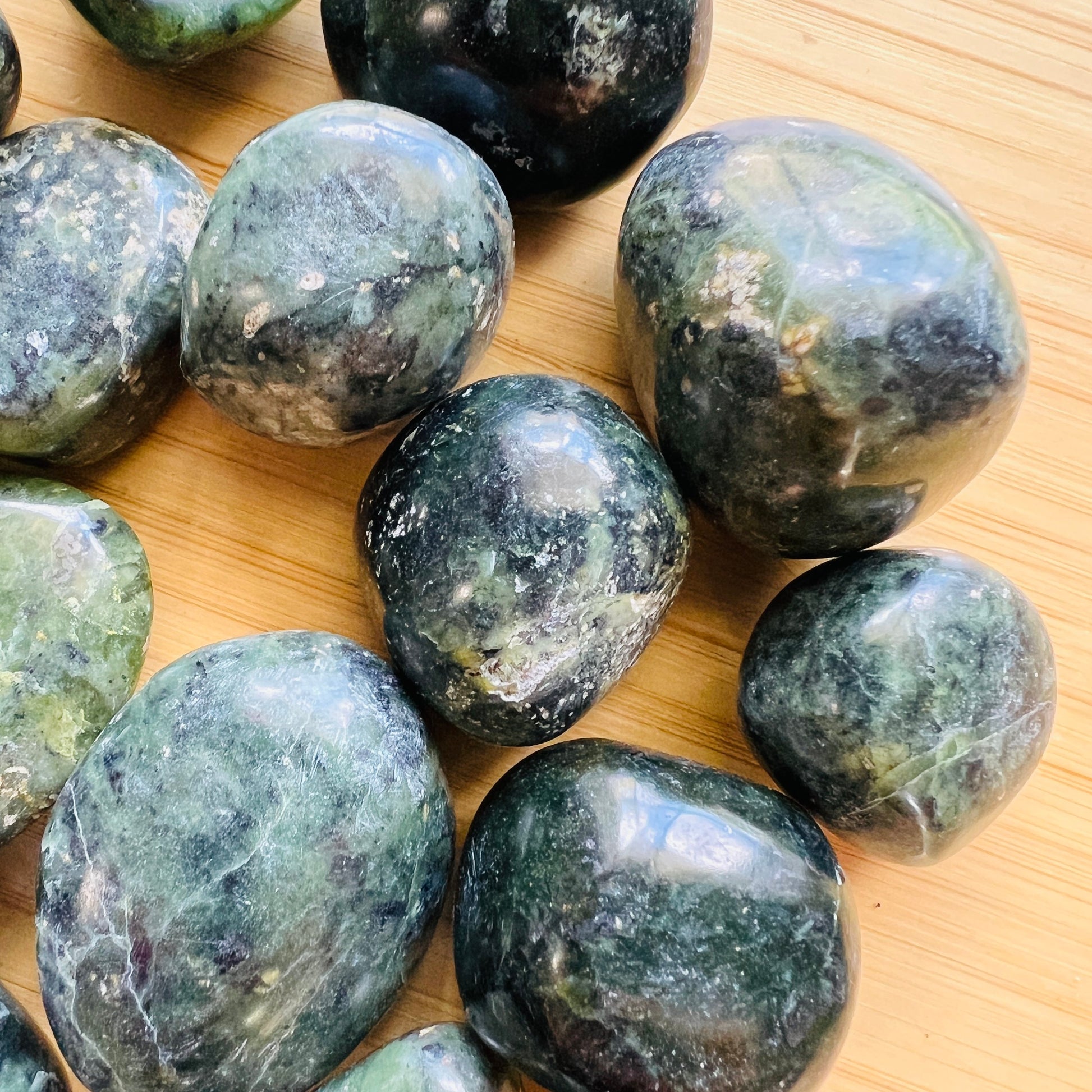 Opposite side of green Jade tumbled stone, from Lima, Peru, showing natural variation.