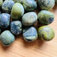 Side-on view of Grade AA Serpentine tumbled stone, sourced from Junín, Peru.