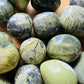 Alternate side of Serpentine tumbled stone, Peru-sourced, showing subtle veining.