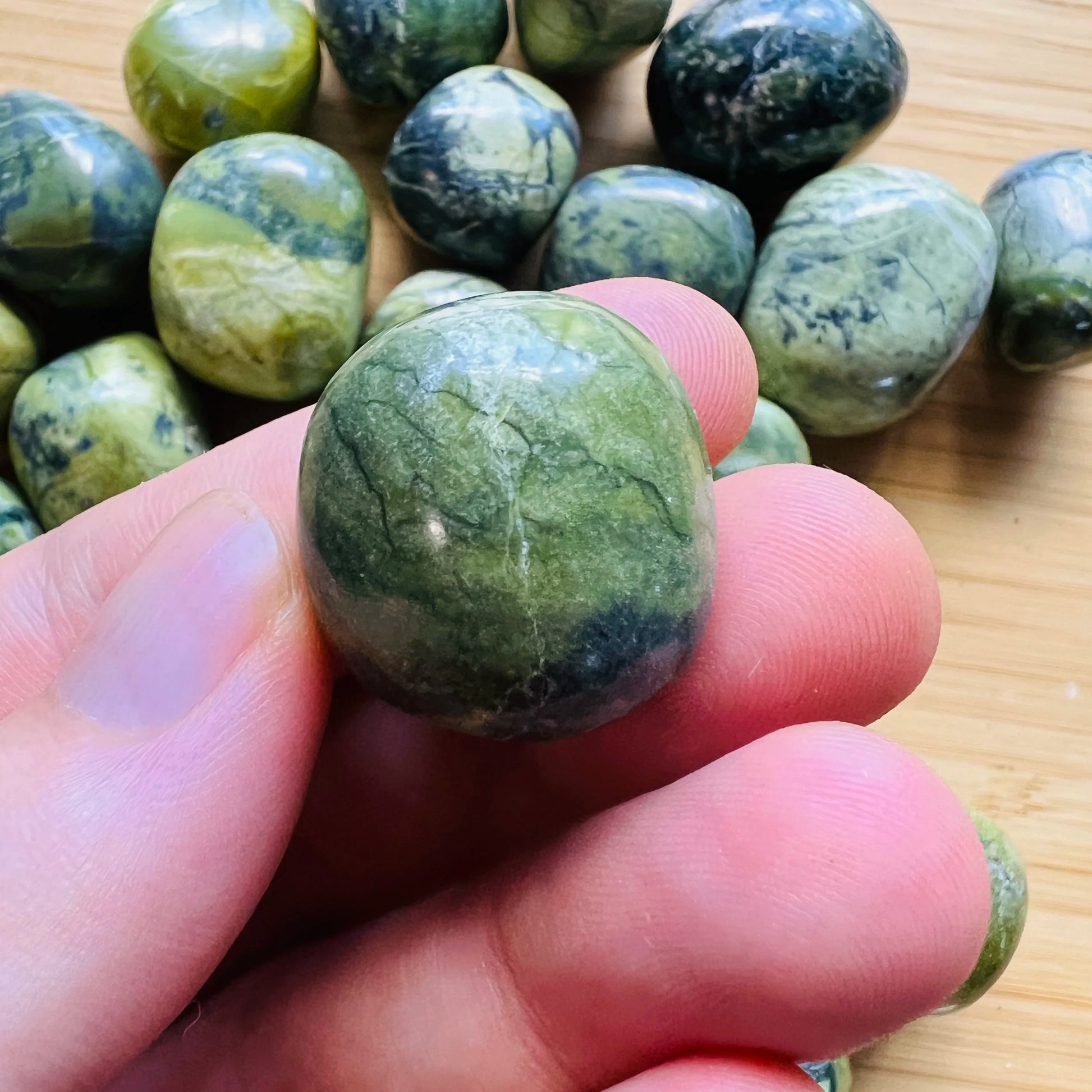 Styled with natural light Serpentine tumbled stone, shown for size reference.