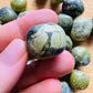 Back view of Grade AA Serpentine tumbled stone showing natural surface