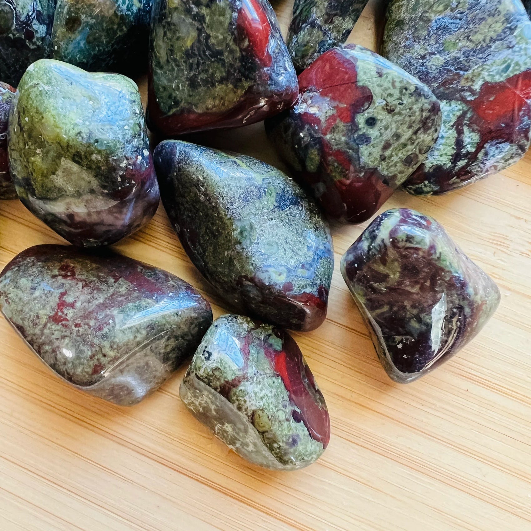 Close-up of Dragon Bloodstone tumbled stone from South Africa, soothing wellness stone for Energy