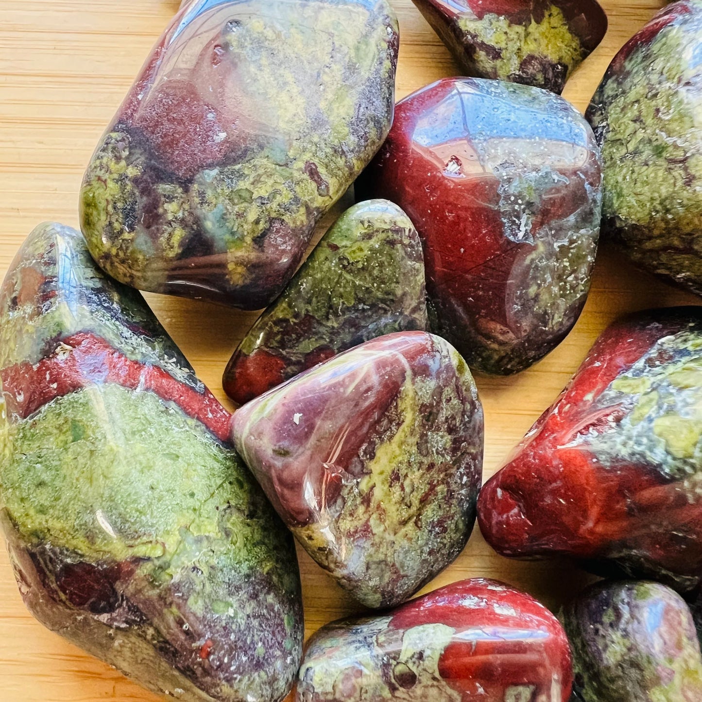 Detail shot of Grade AA Dragon Bloodstone tumbled stone under natural light