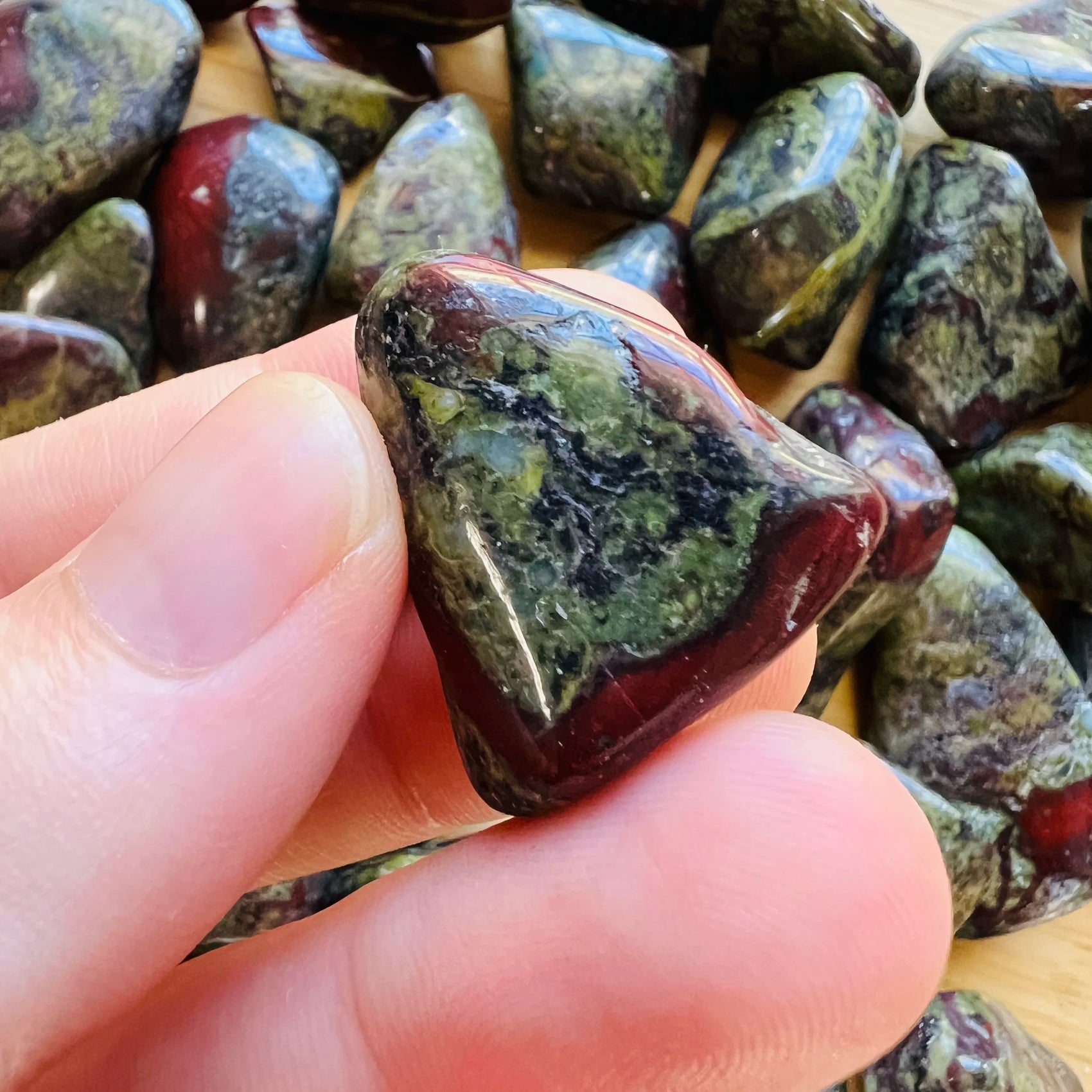 Handheld Dragon Bloodstone tumbled stone from South Africa for meditation, Energy and Protection