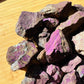 Profile view of Purpurite raw stone, from Erongo, Namibia, showing natural banding.