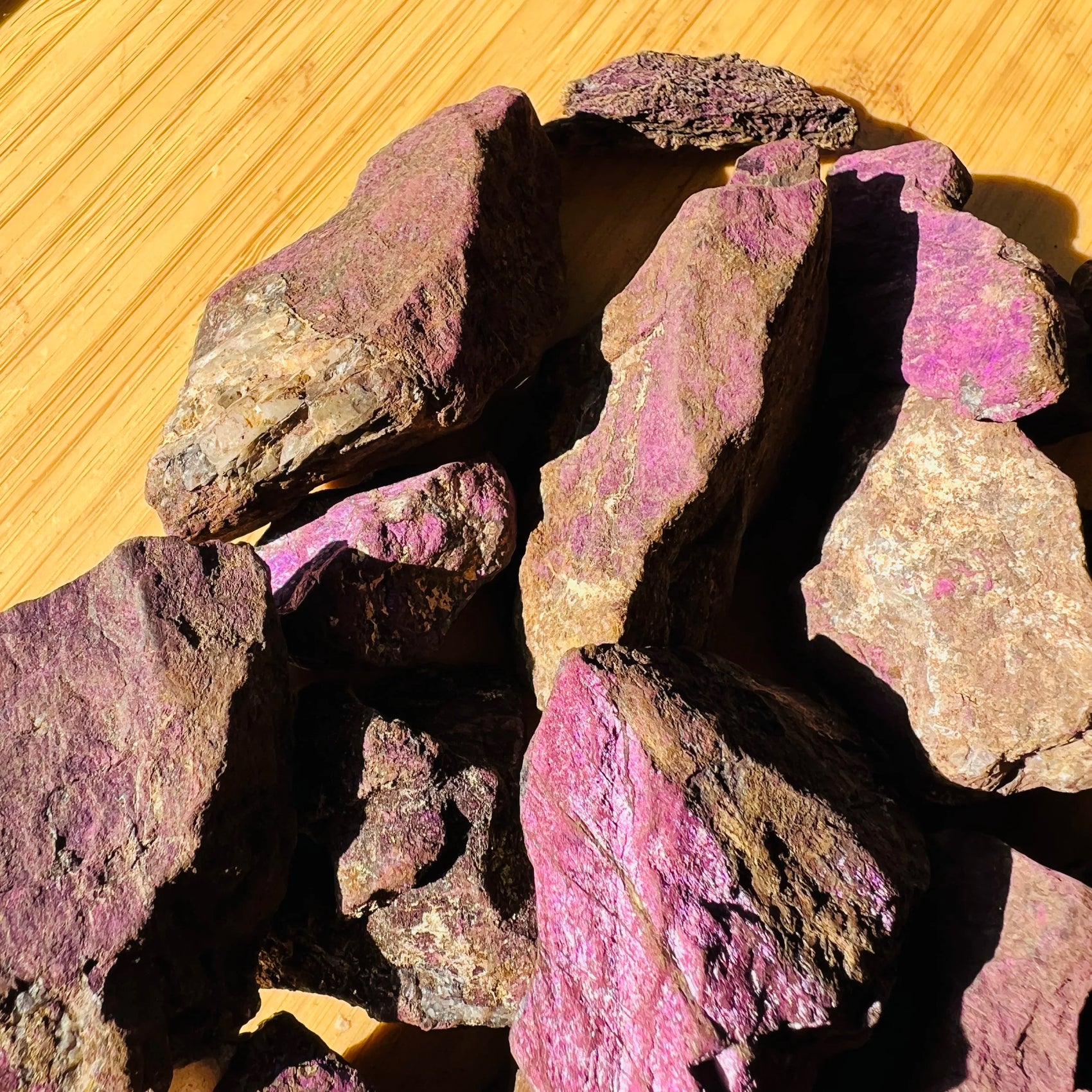 Alternate angle of Purpurite raw stone, showing natural patina.