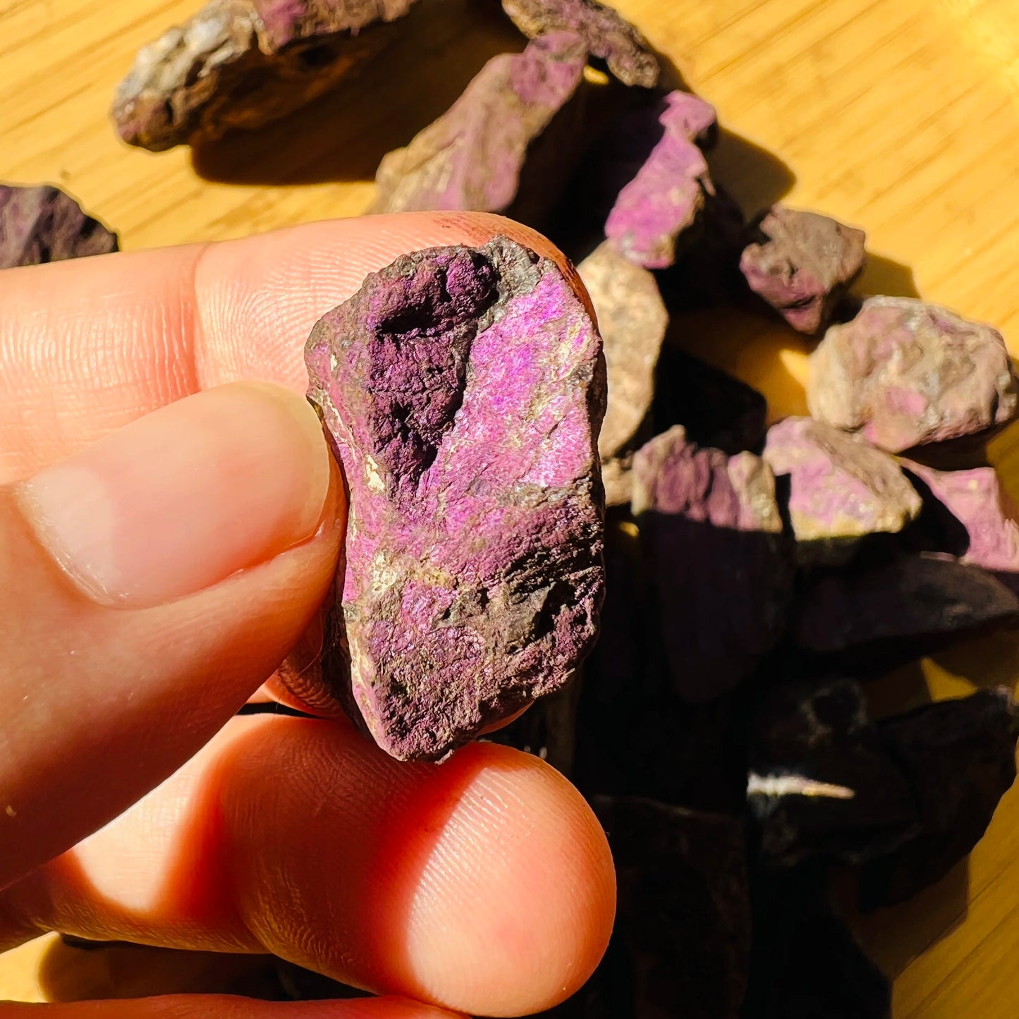 Back view of Grade A Purpurite raw showing natural surface