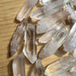 Profile view of Grade A Clear Quartz raw point, Madagascar-sourced.