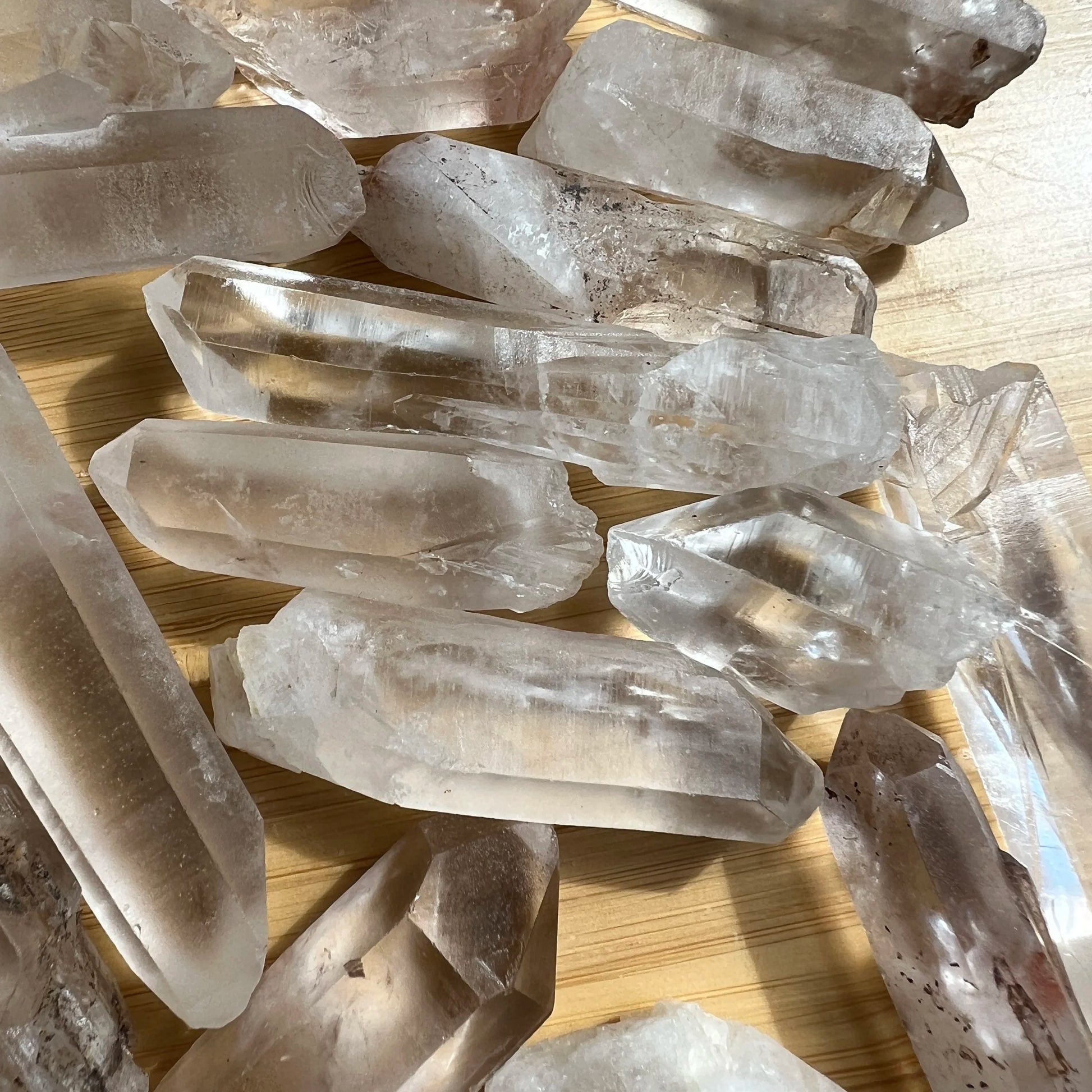 Alternate angle of Clear Quartz raw point, sourced from Alaotra-Mangoro, Madagascar, showing characteristic color.