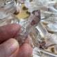 Lifestyle view of a Clear Quartz raw point, sourced from Madagascar.