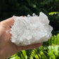 Palm-scale view of a Clear Quartz specimen linked to Cleansing and Meditation.