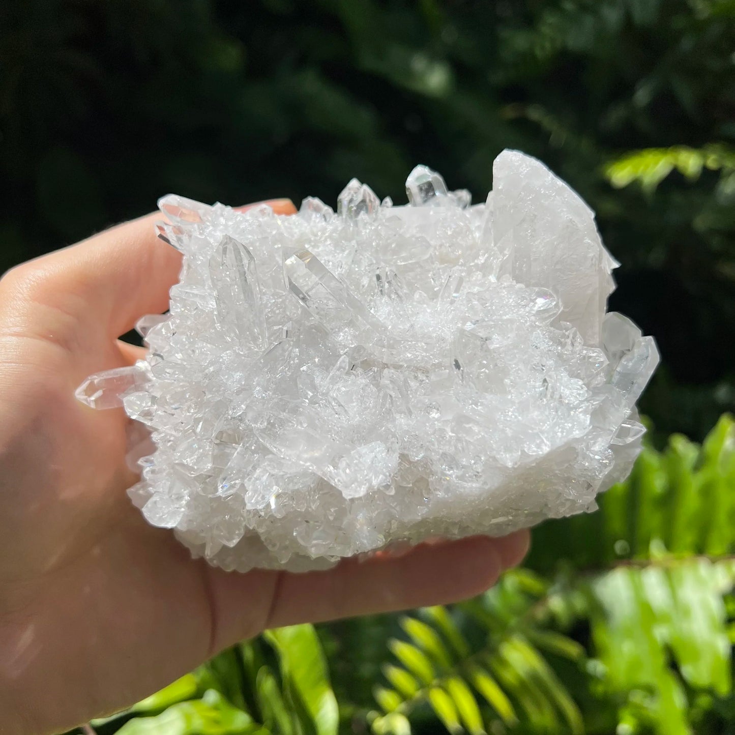 Palm-scale view of a Clear Quartz specimen linked to Cleansing and Meditation.