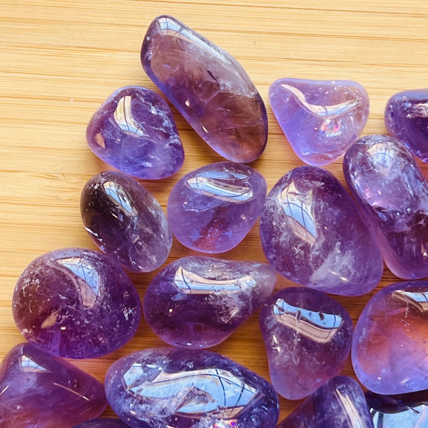 Plan view of Amethyst tumbled stone, showing translucent edges.