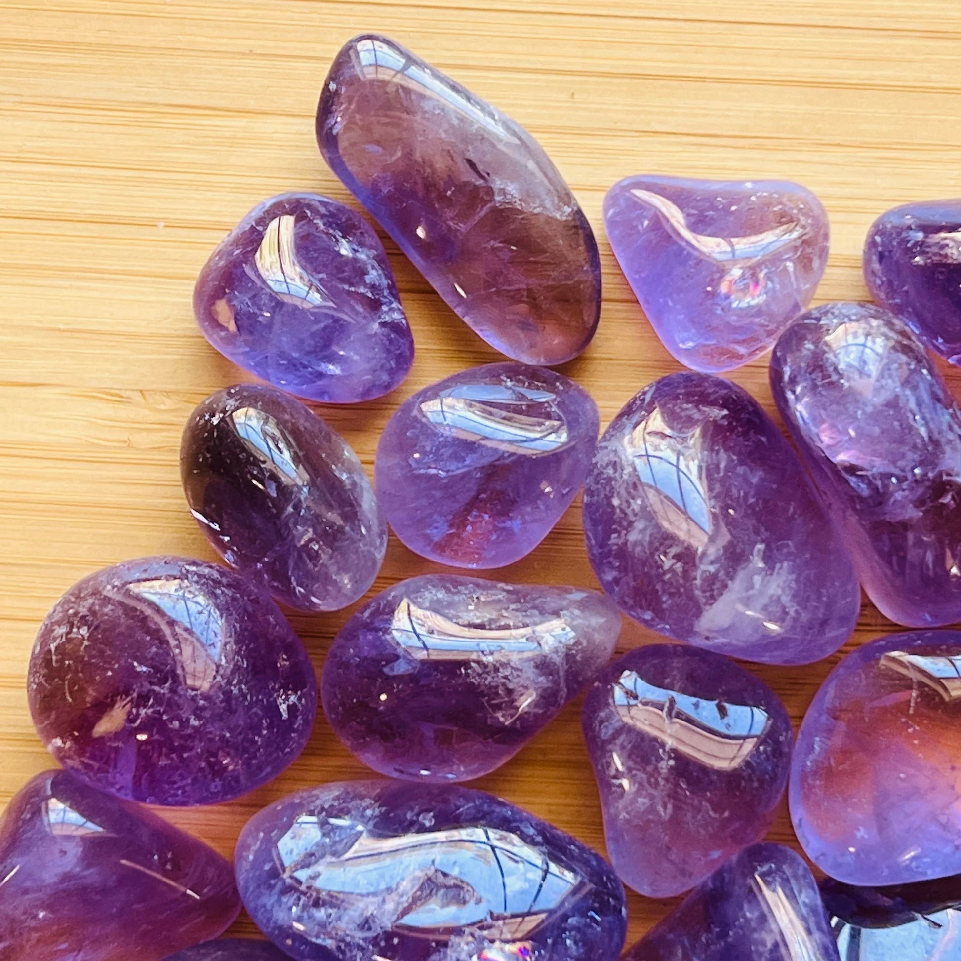 Plan view of Amethyst tumbled stone, showing translucent edges.