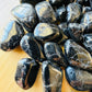 Natural surface of Black Tourmaline tumbled stone, kept close for Protection.