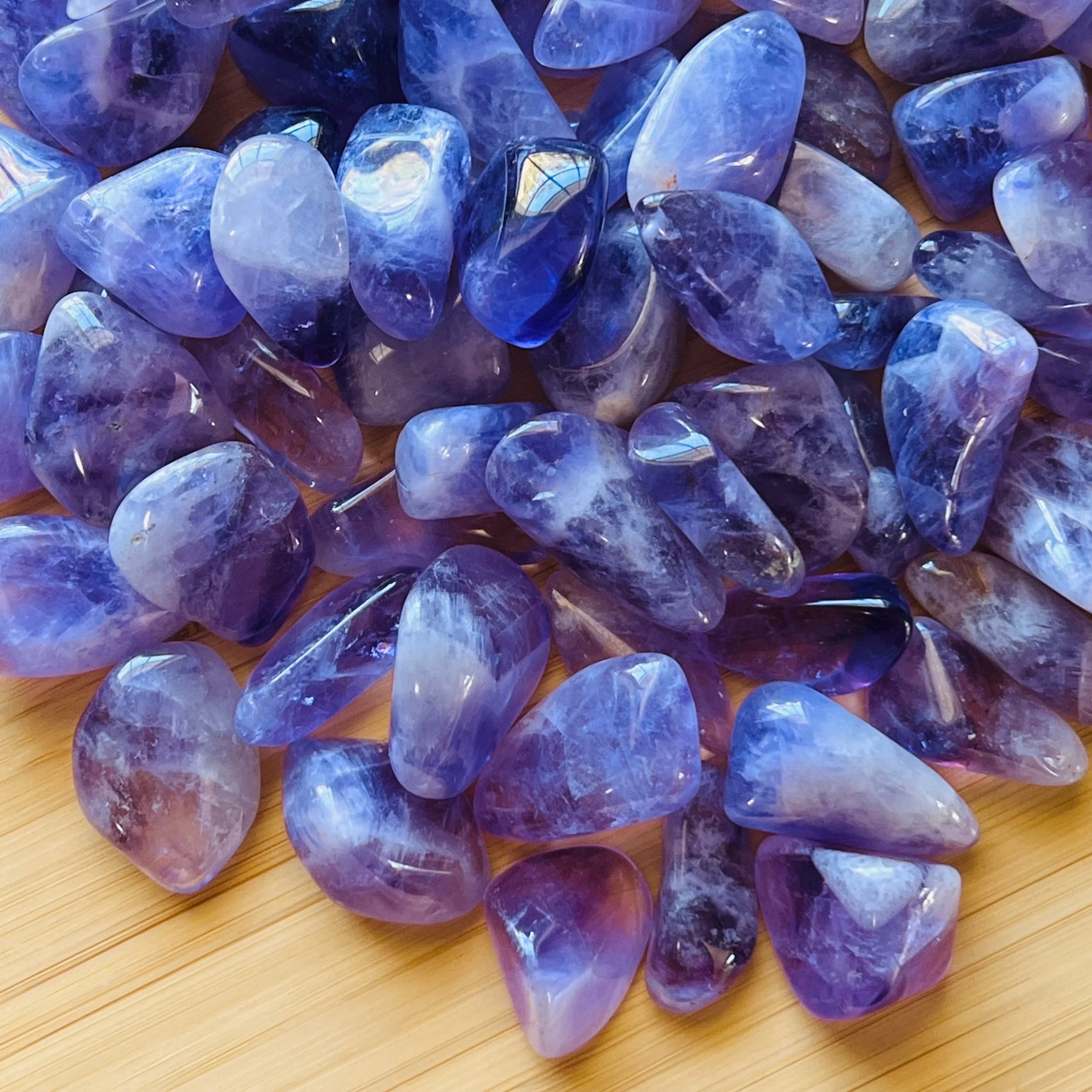 Top angle of Amethyst tumbled stone, traditionally used for Stress Relief, sourced from Analamanga, Madagascar.