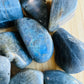 Edge-on view of Labradorite tumbled stone, showing characteristic patterning, often paired with practices around Intuition.