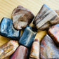 Rear view of Petrified Wood tumbled stone, showing characteristic color.