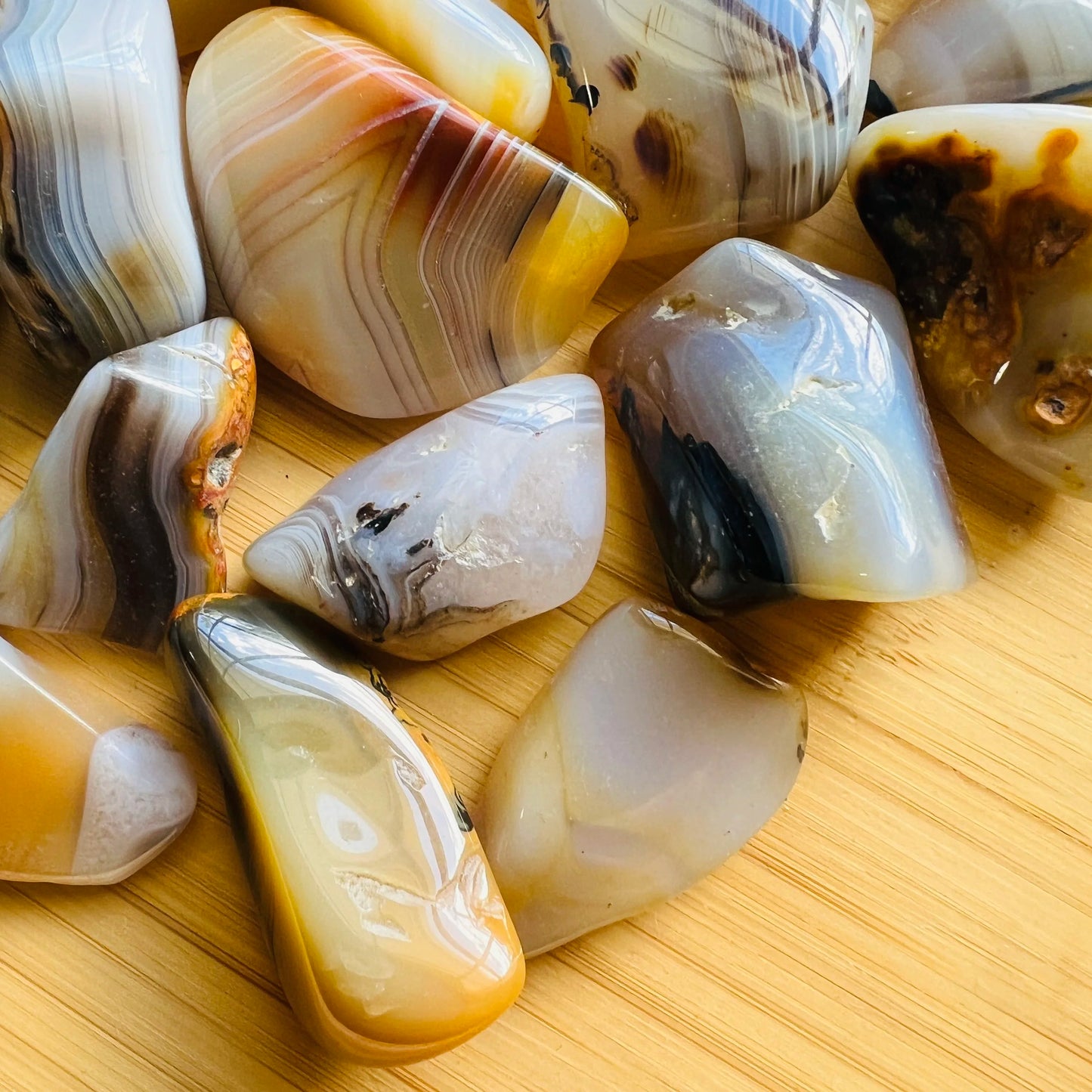 Side-on view of Dendritic Agate tumbled stone, sourced from Madagascar.