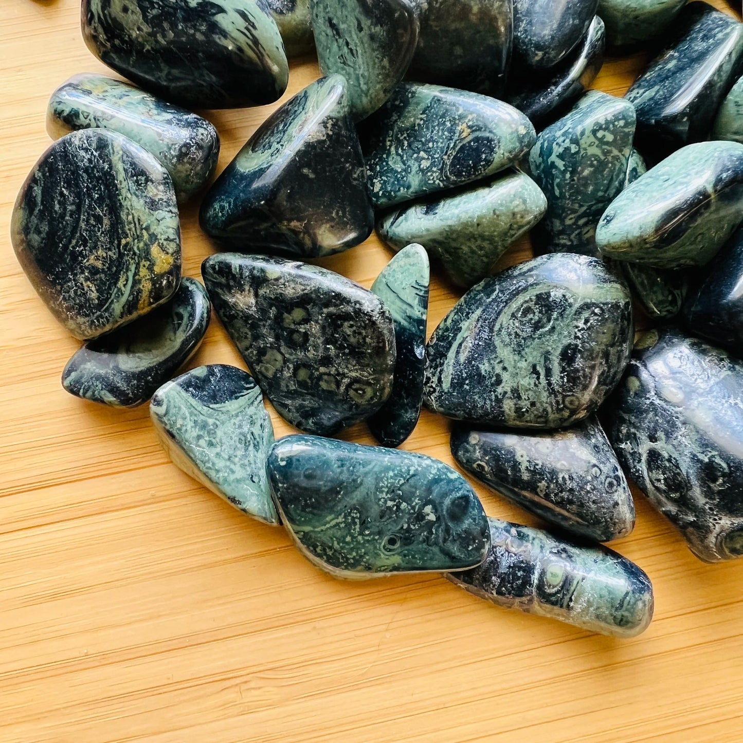 Rear view of Kambaba Jasper tumbled stone, showing matte finish.