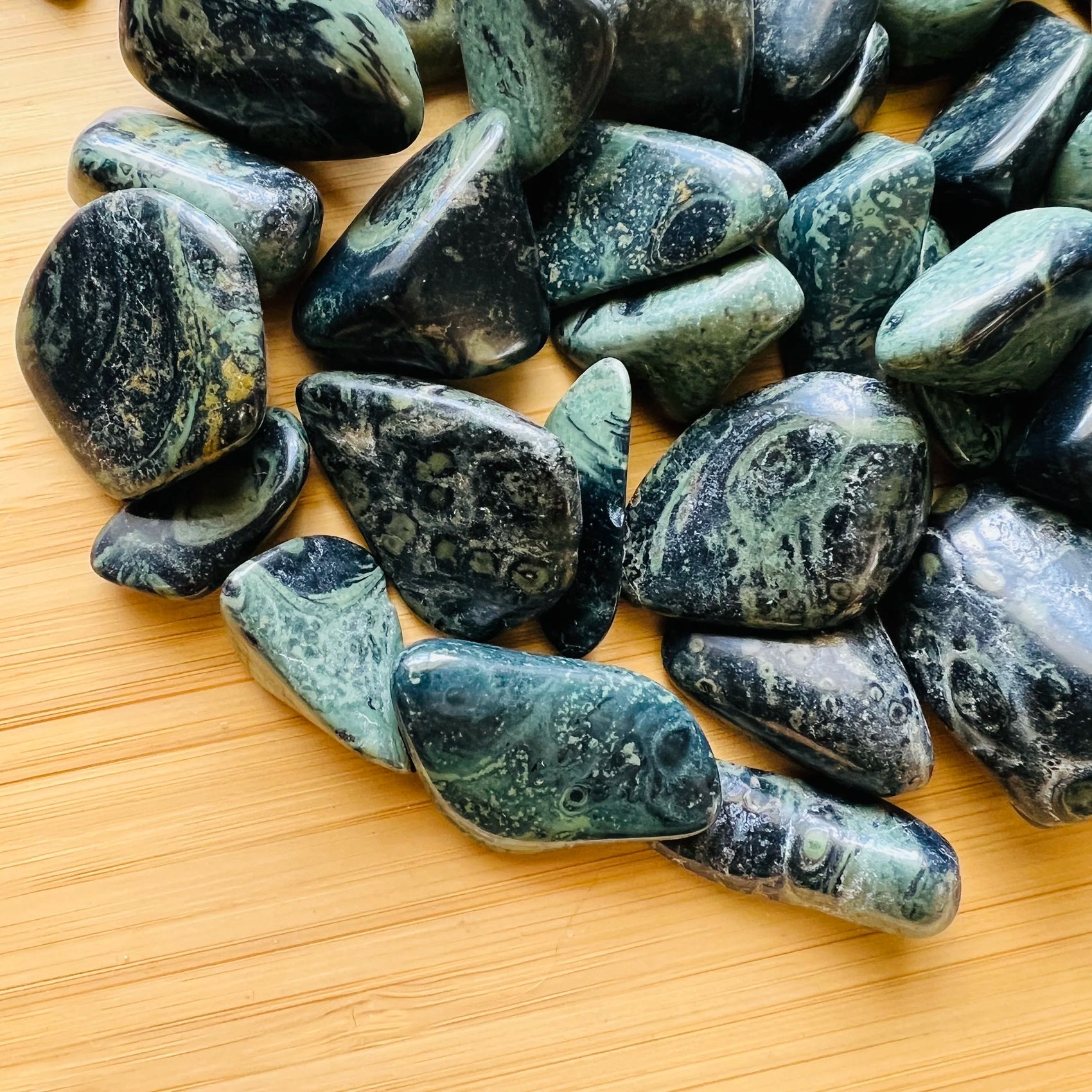 Rear view of Kambaba Jasper tumbled stone, showing matte finish.
