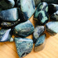 Edge-on view of Kambaba Jasper tumbled stone, showing matte finish, drawn on for Grounding.