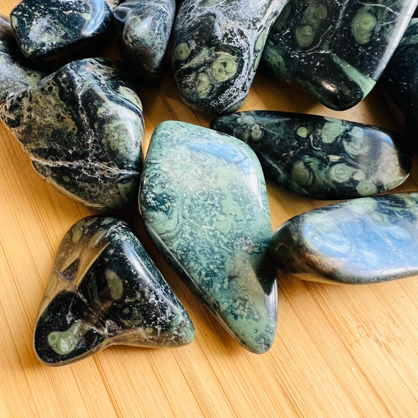 Magnified detail of Kambaba Jasper tumbled stone, showing natural sheen, sourced from Madagascar.