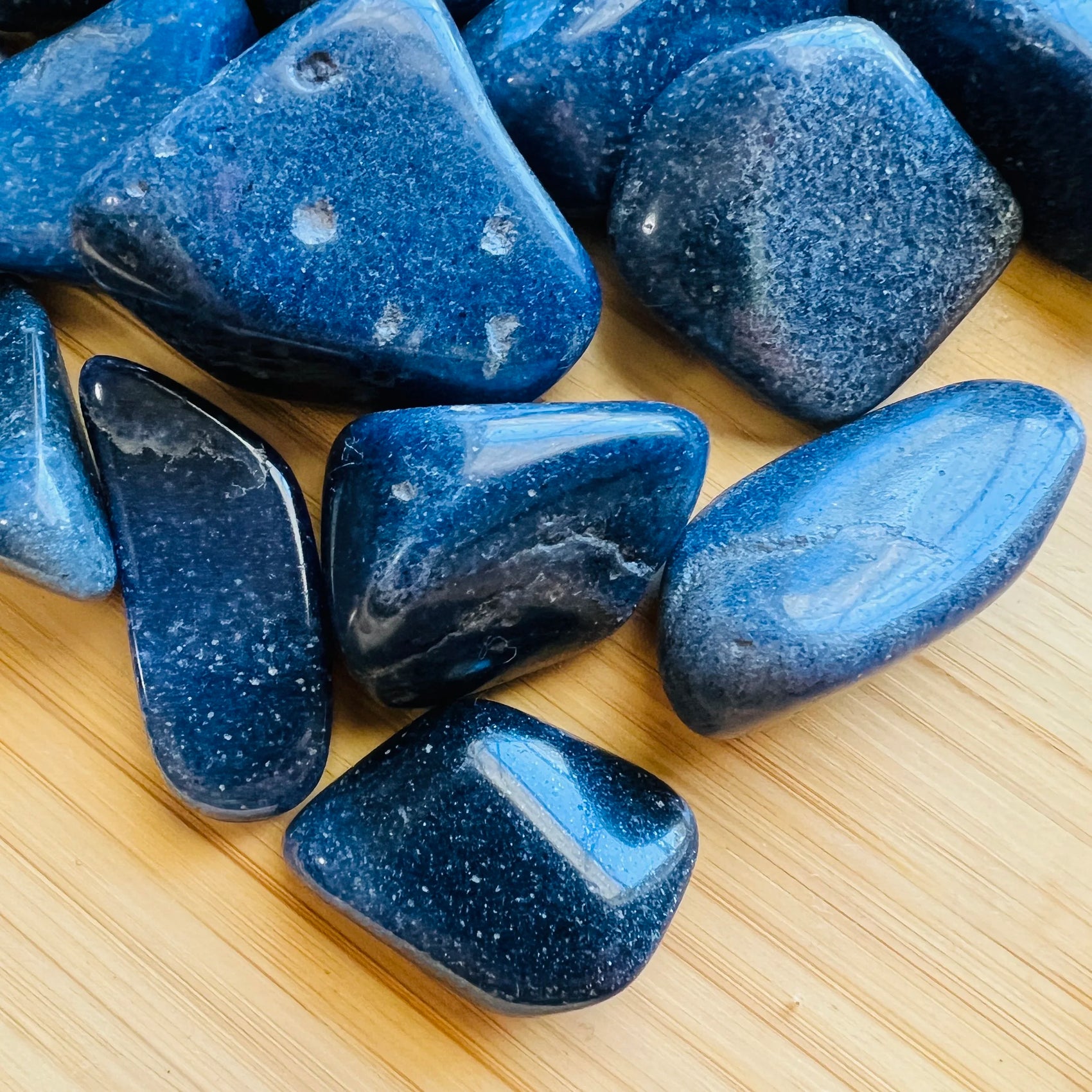 Side angle of Lazulite tumbled stone, hand-selected from Amoron'i Mania, Madagascar.