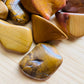Underside view of Yellow Jasper tumbled stone, carried for Confidence.