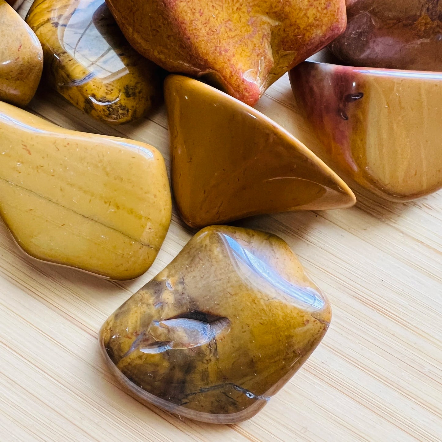 Underside view of Yellow Jasper tumbled stone, carried for Confidence.