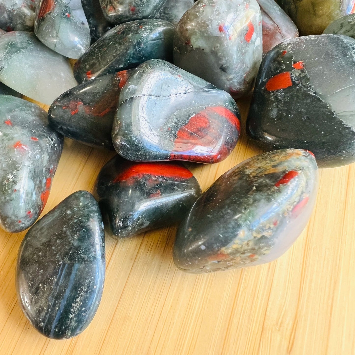Underside view of Bloodstone tumbled stone, showing characteristic patterning.