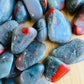 Bottom side of Bloodstone tumbled stone, showing matte finish.
