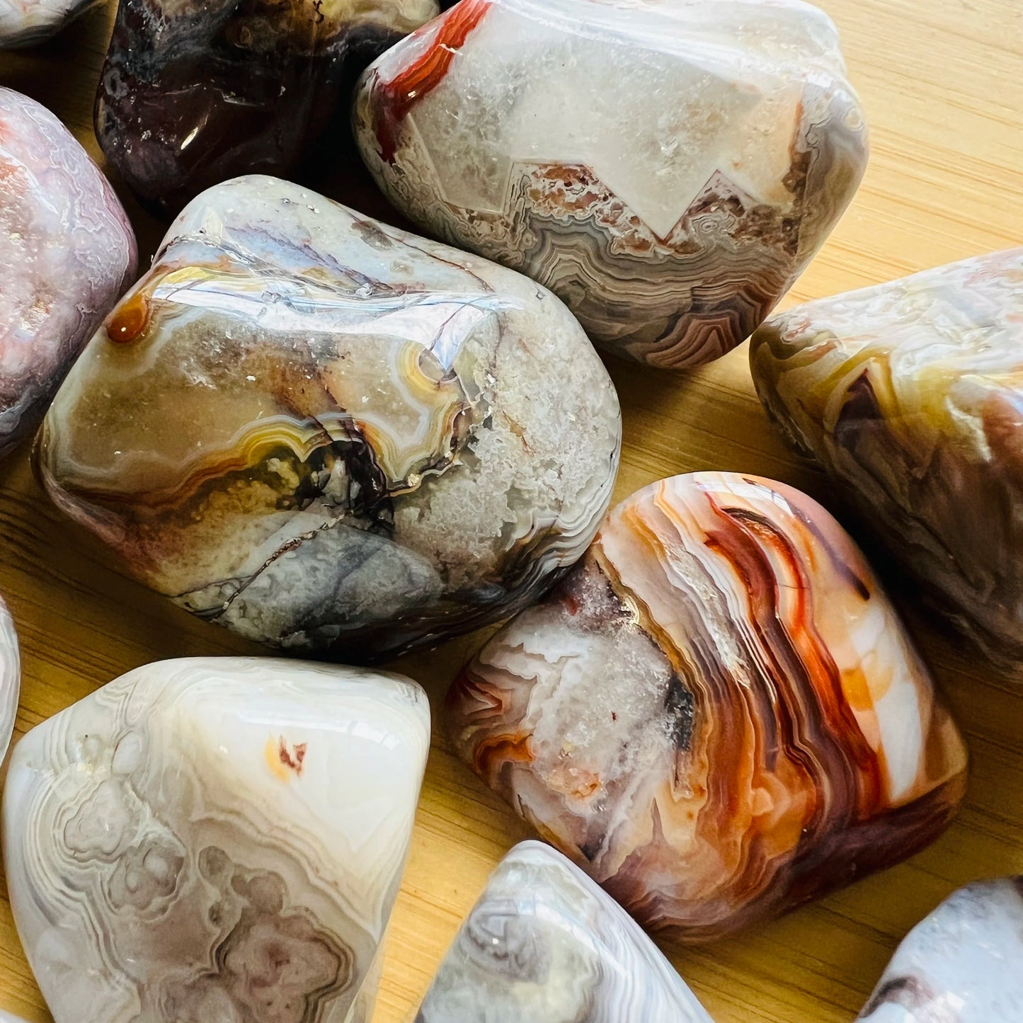 Alternate angle of Grade A Crazy Lace Agate tumbled stone showing overall shape