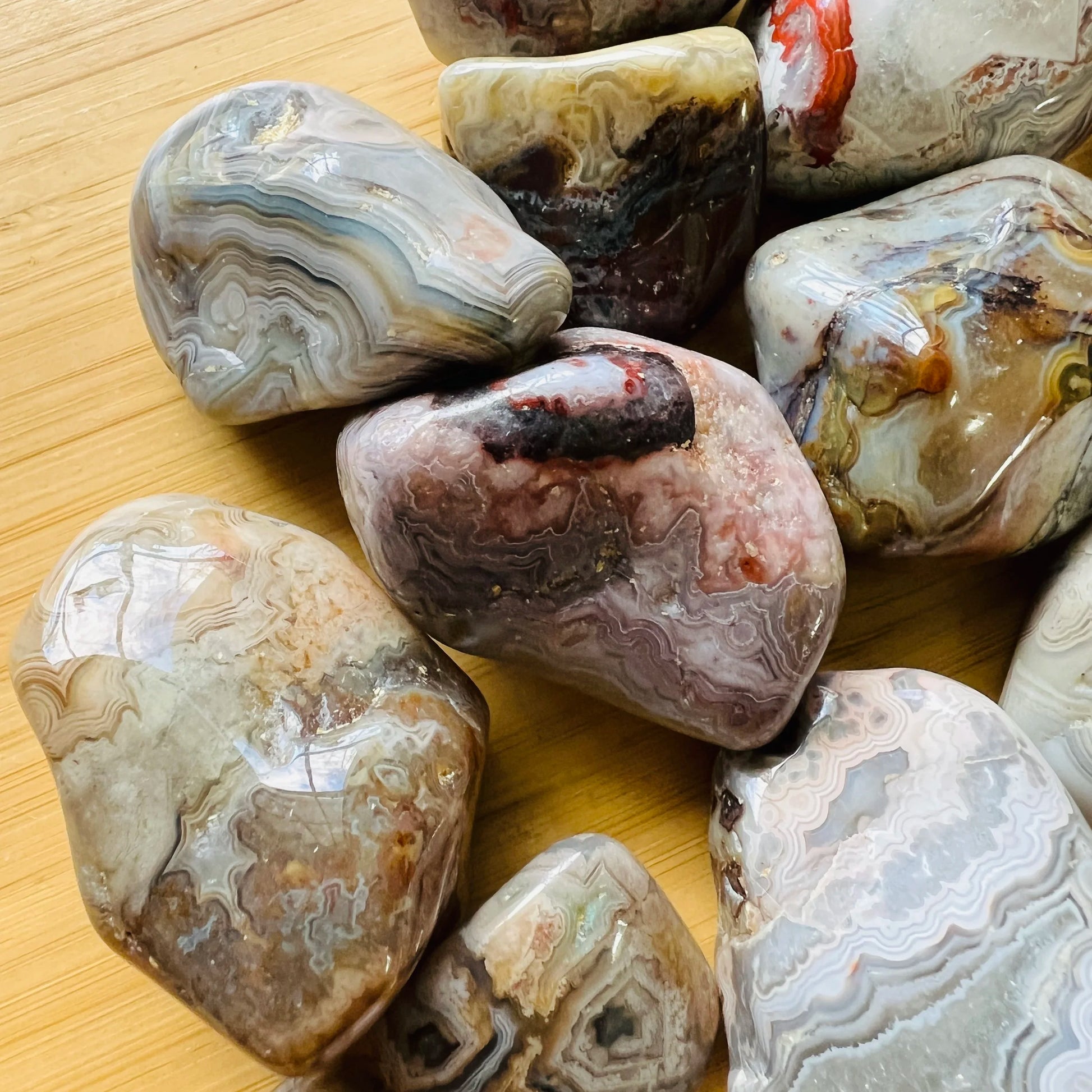Top view of Grade A Crazy Lace Agate tumbled stone, sourced from Chihuahua, Mexico