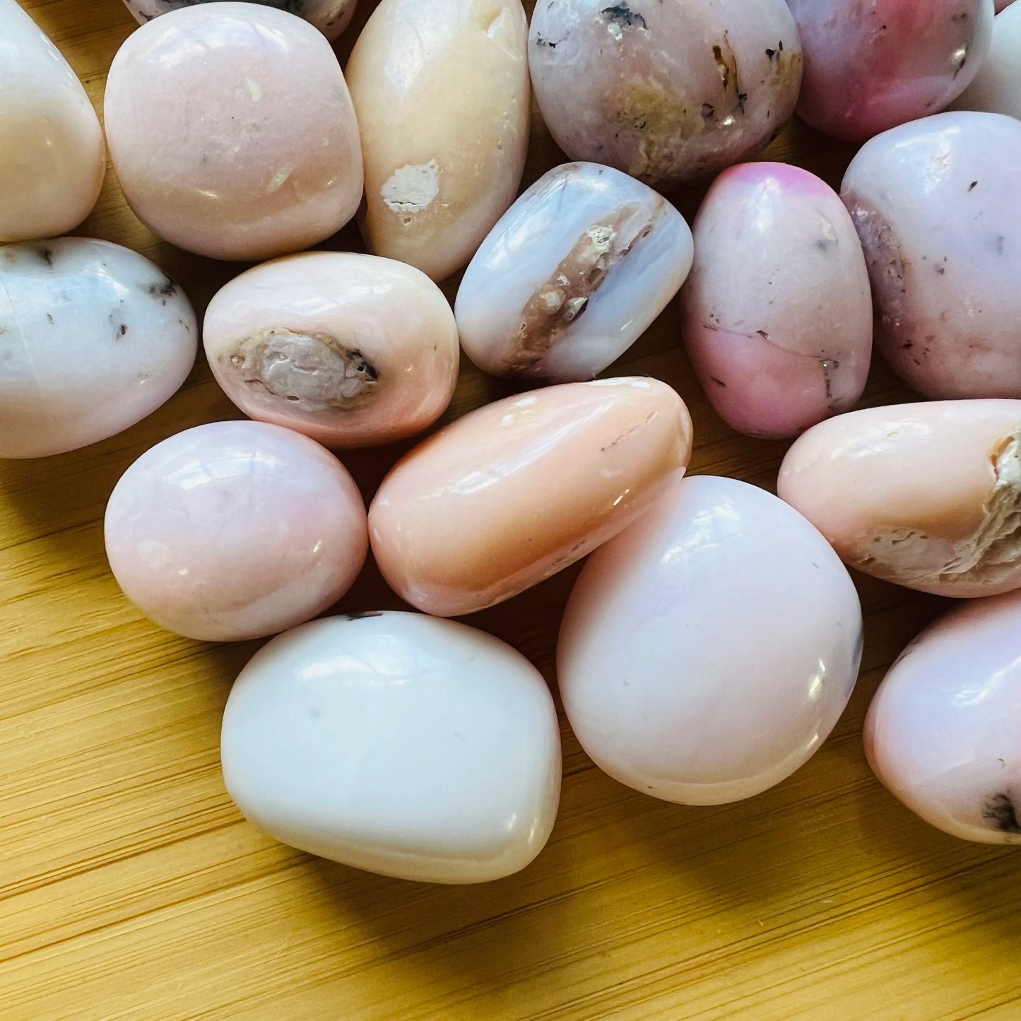 Detail capture of Pink Opal tumbled stone, showing characteristic patterning.