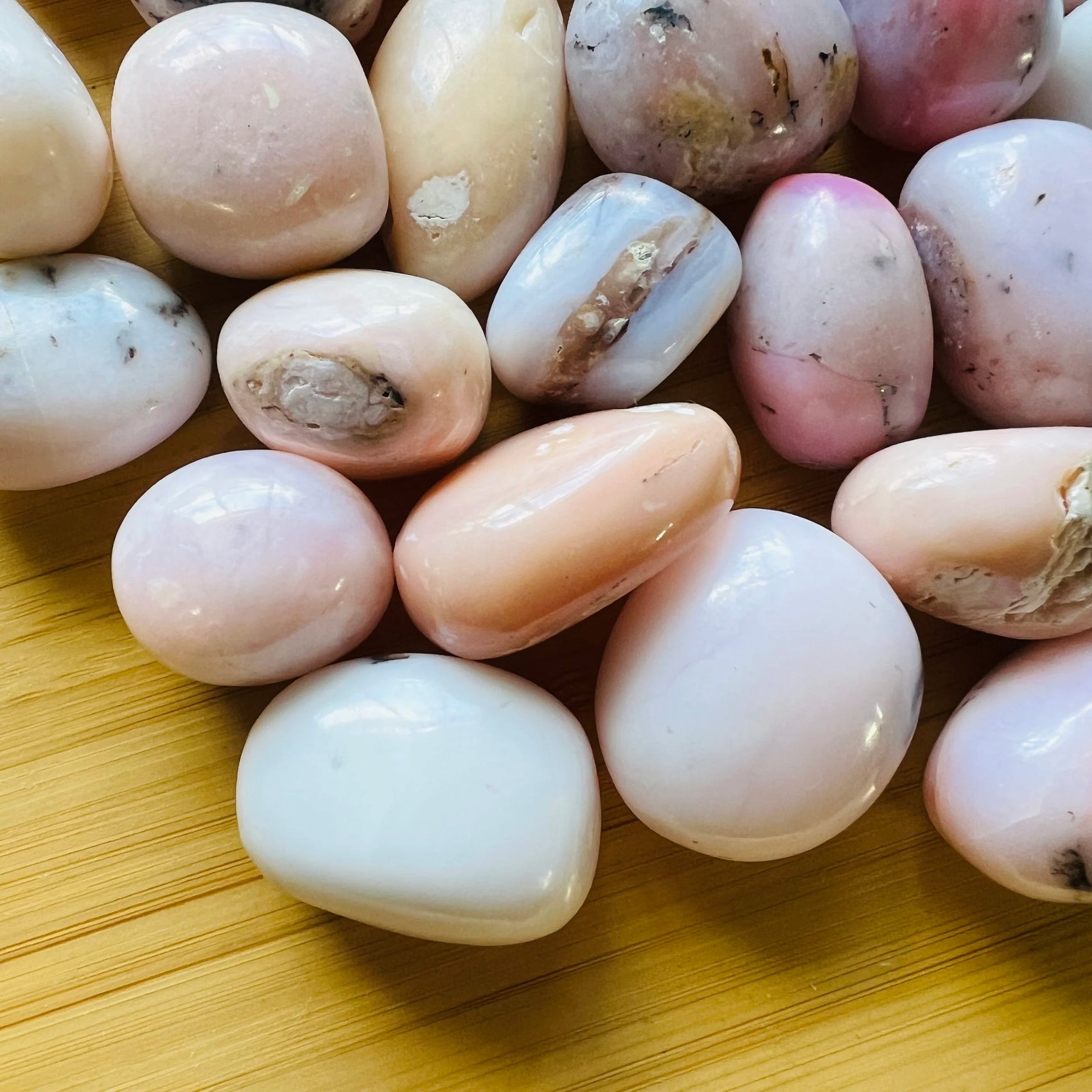 Detail capture of Pink Opal tumbled stone, showing characteristic patterning.