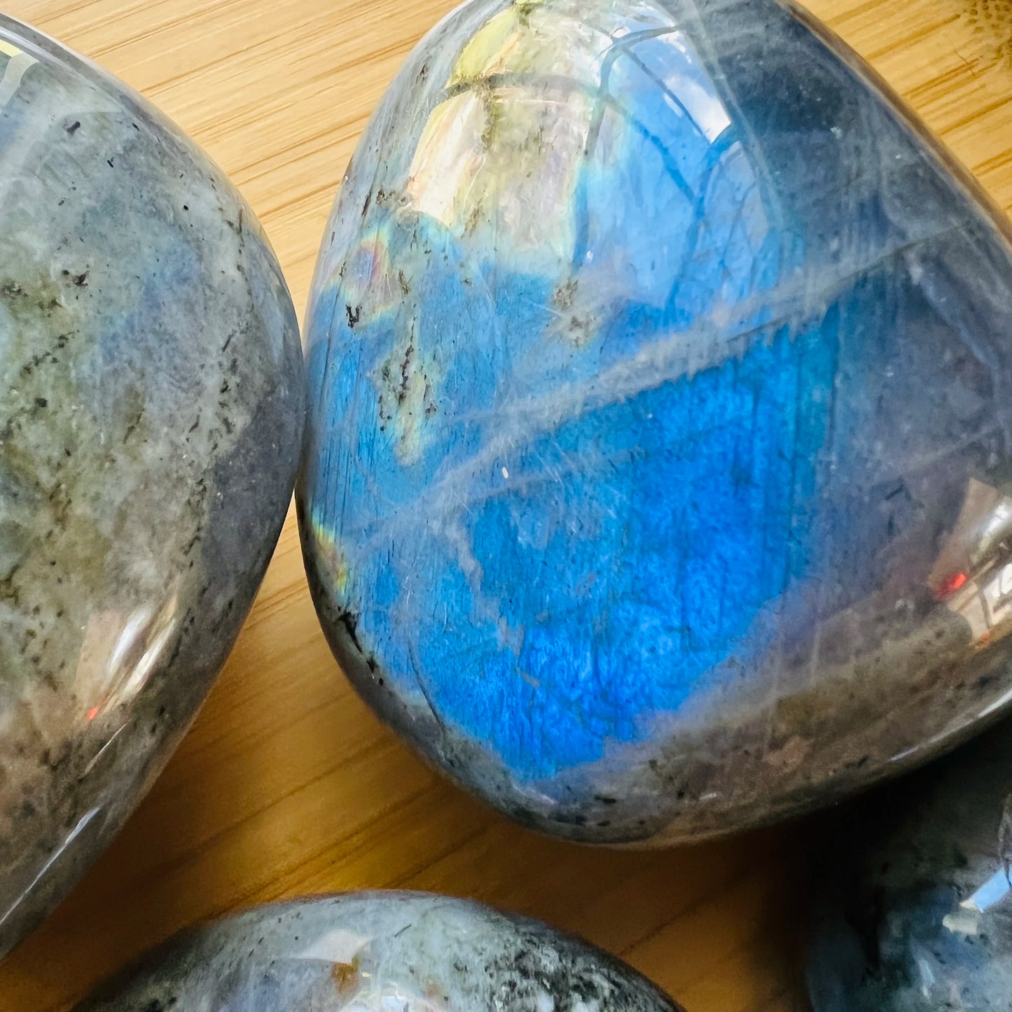 Plan view of Labradorite palm stone, showing characteristic finish.