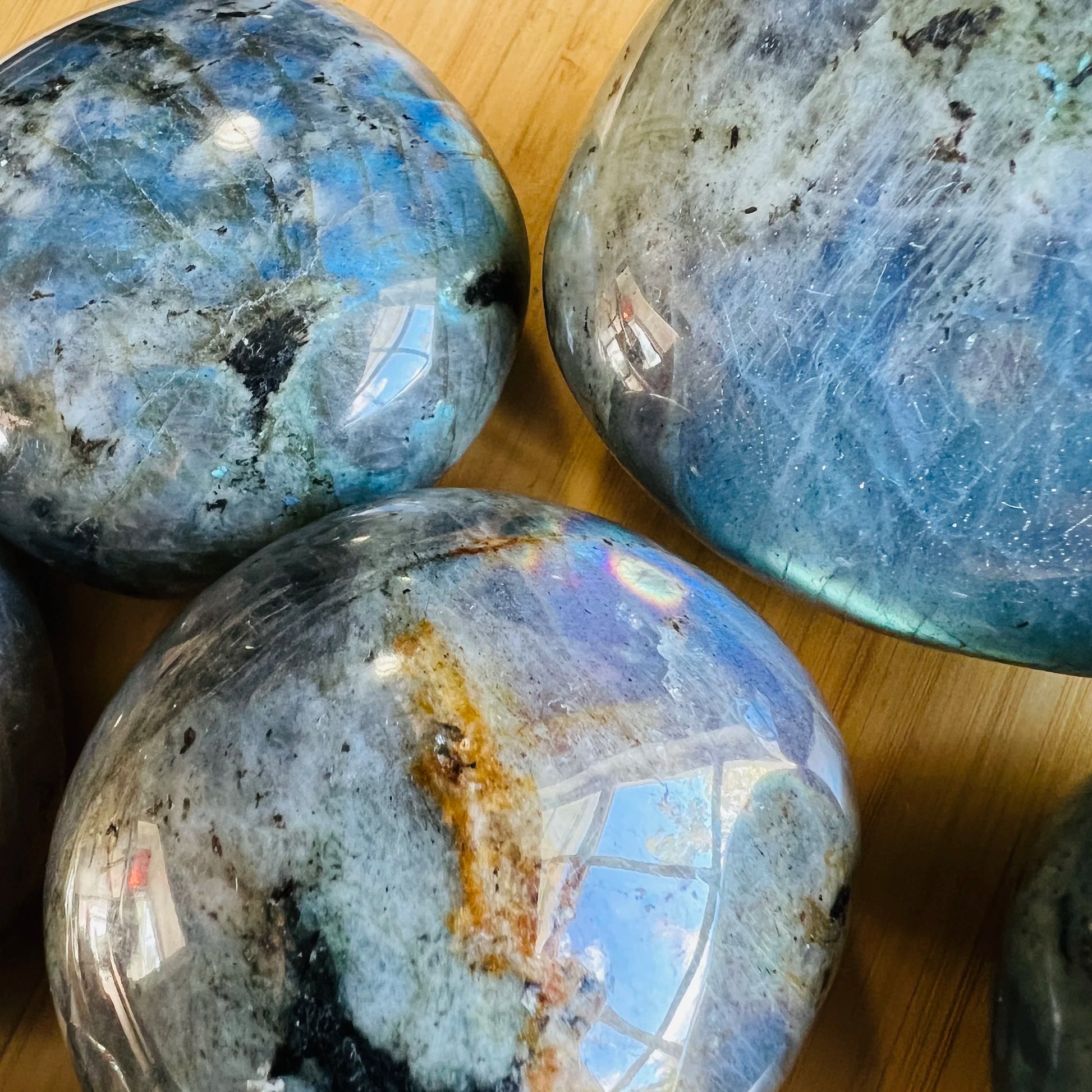 Underside detail of Labradorite palm stone, traditionally used for Intuition and Protection, showing natural texture.