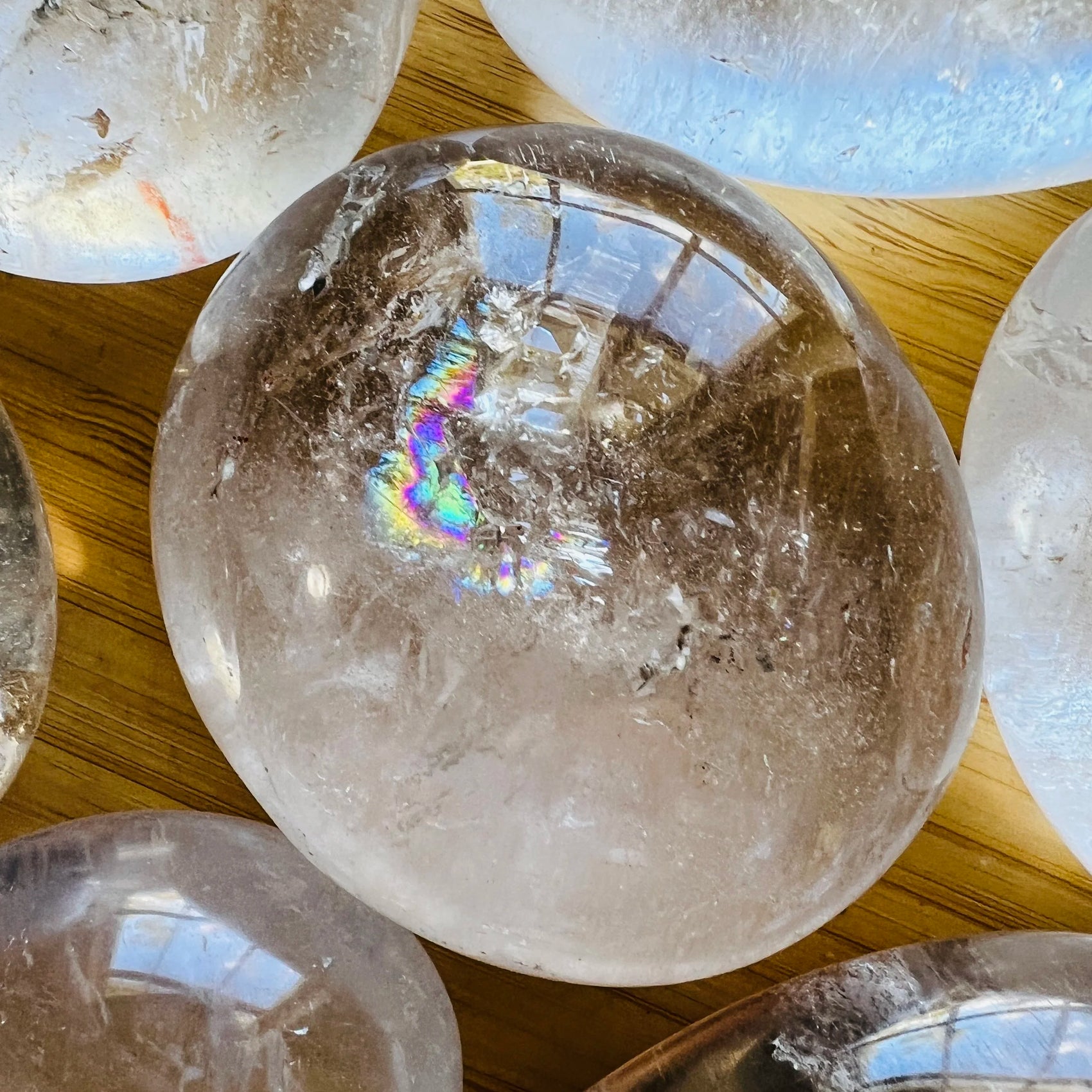 Side angle of Grade AA Clear Quartz palm stone, Madagascar-sourced.