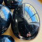 Top view of Black Tourmaline palm stone, showing soft luster, from Alaotra-Mangoro, Madagascar.