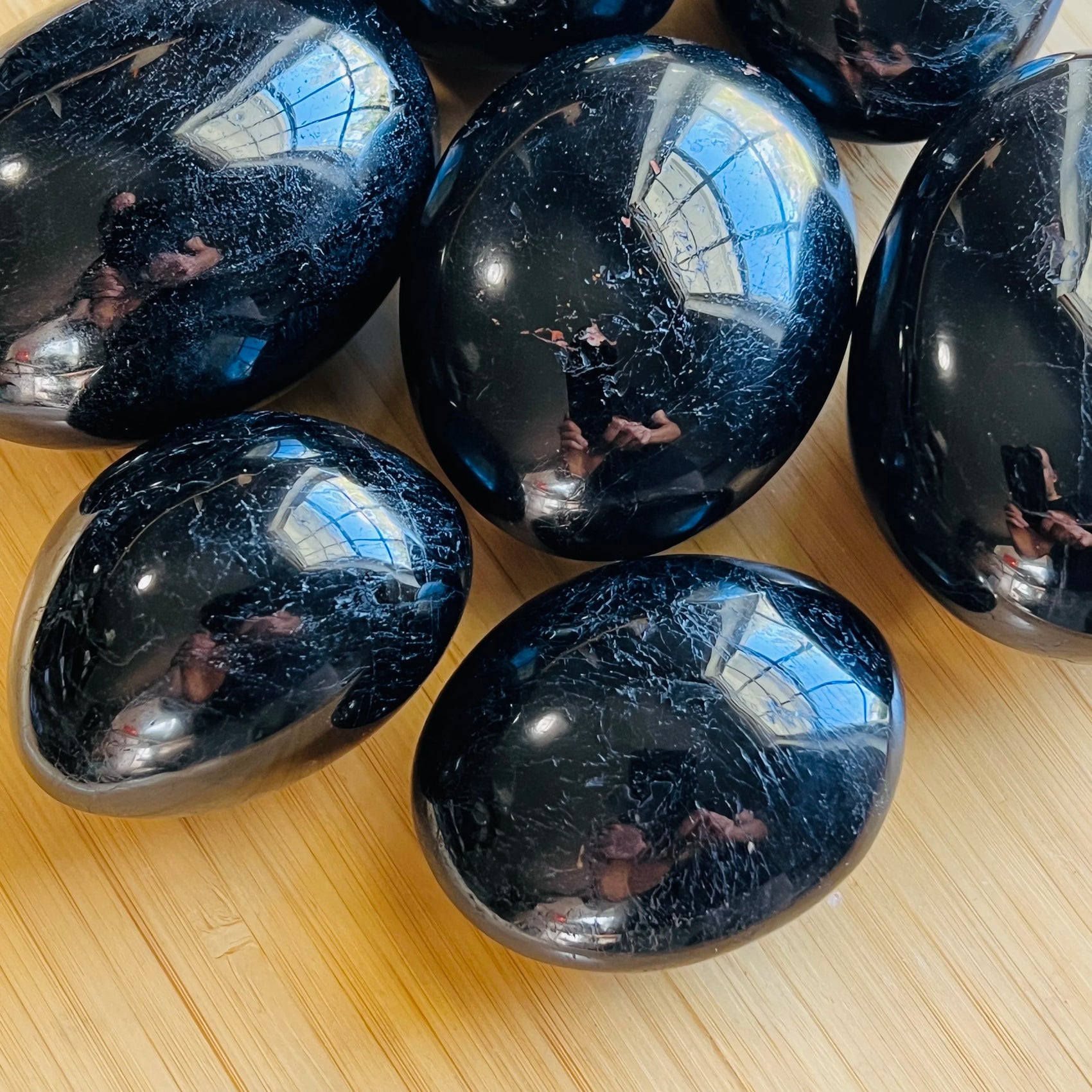 Bulk Black Tourmaline palm stones from Madagascar, Black stones for Stress Relief