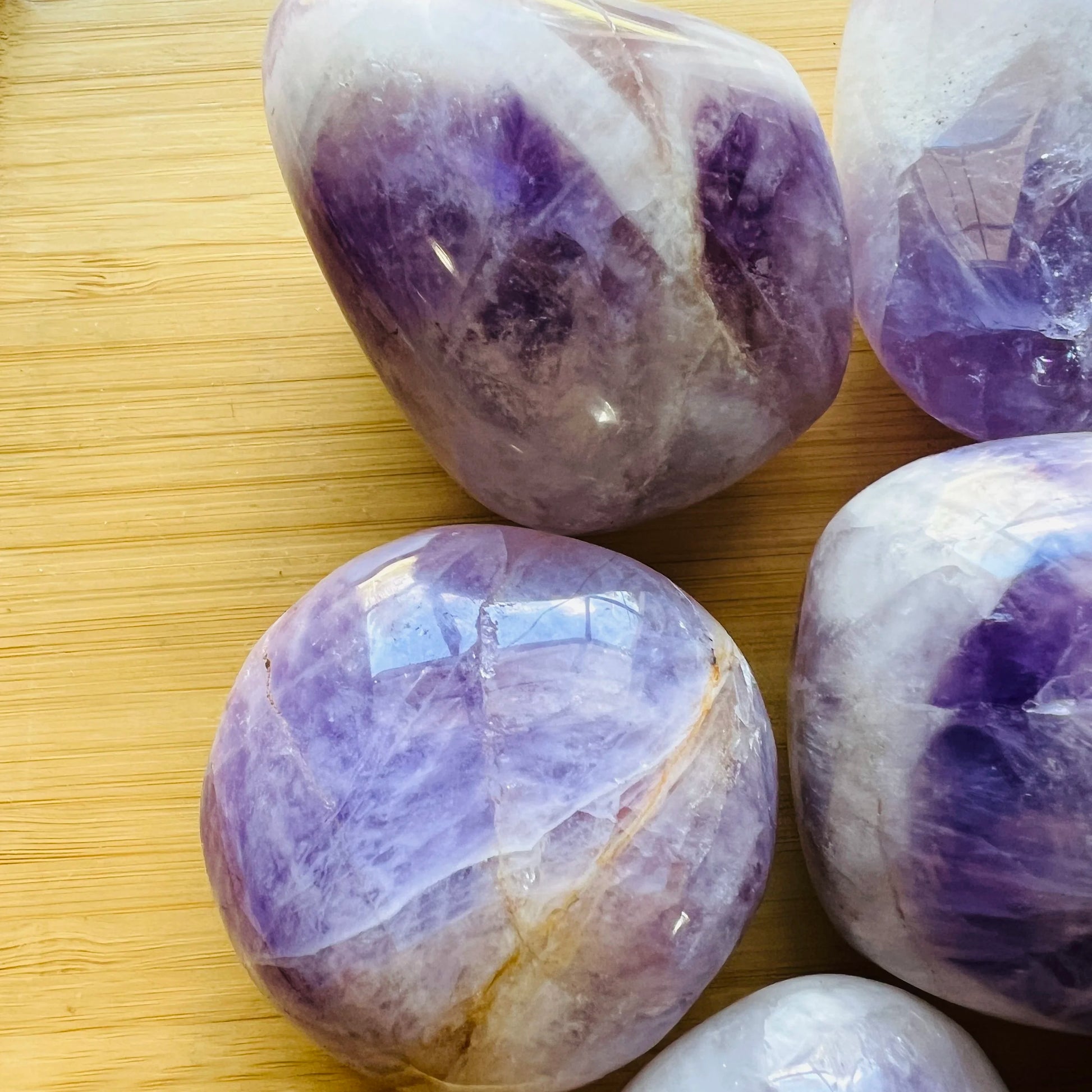 Detail shot of Grade A Banded Amethyst palm stone under natural light
