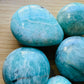 Underside detail of Amazonite palm stone, showing color depth, drawn on for Stress Relief and Emotional Healing.
