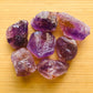 Detail shot of Grade AA Ametrine raw under natural light