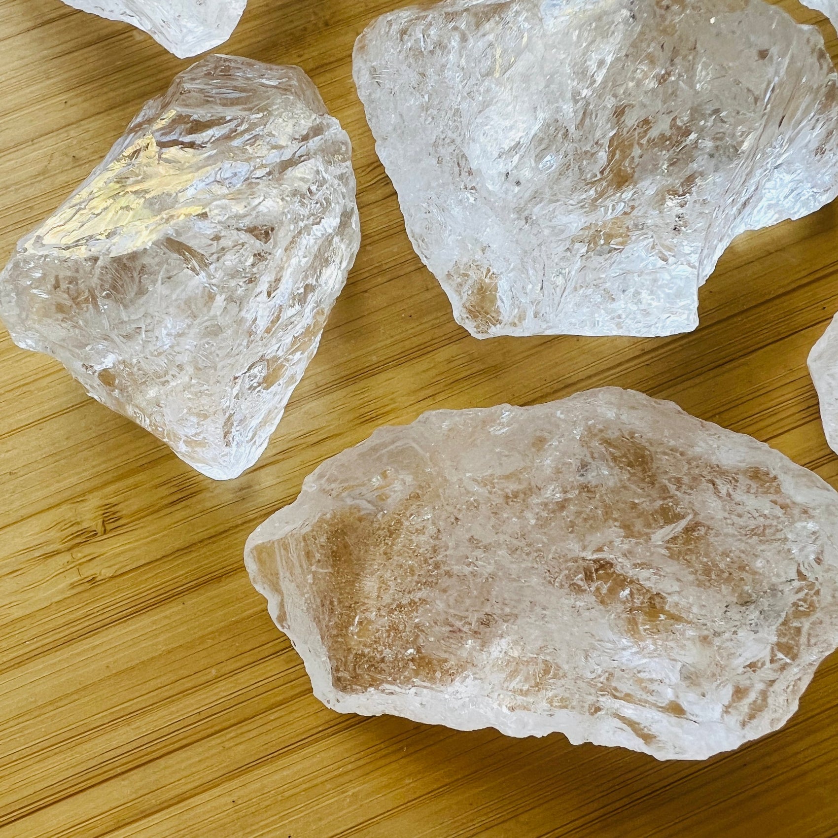 Back view of Clear Quartz raw stone, showing natural inclusions, carried for Cleansing.